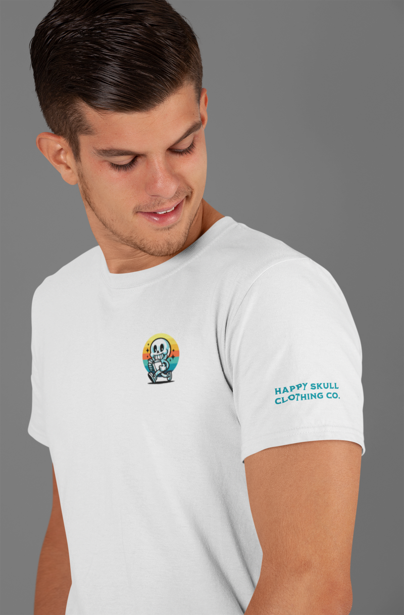 A black t-shirt with a small cartoon graphic on the chest and white text on the sleeve is displayed against a colorful, abstract graffiti background.