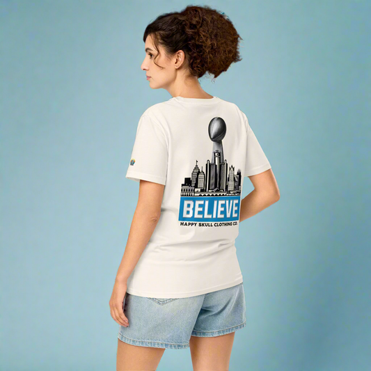 Person wearing a white t-shirt with a graphic design on the back, standing against a white background.