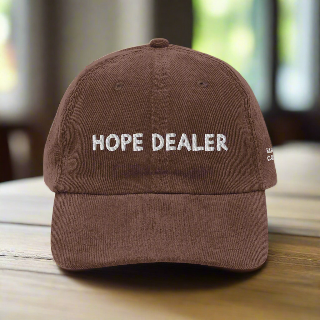 Brown cap with 'HOPE DEALER' text on a white background