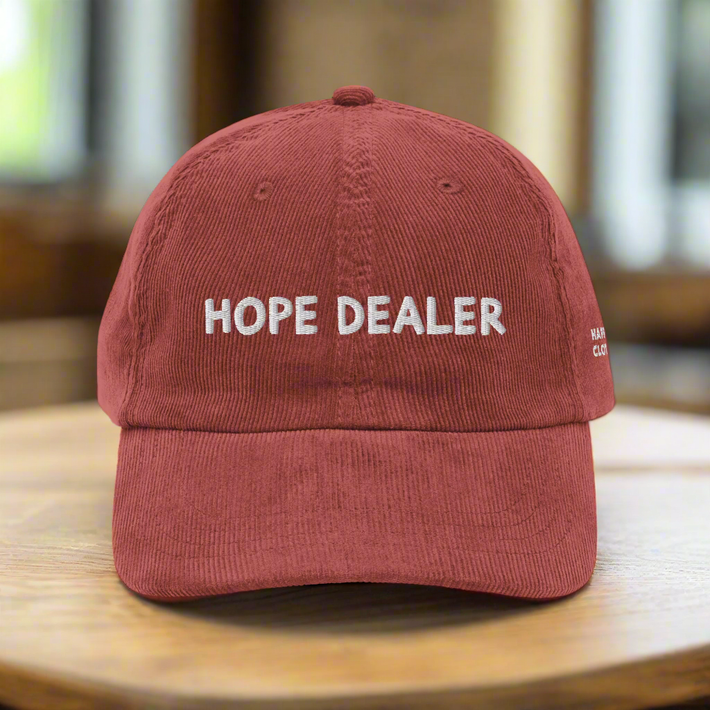 Red cap with 'HOPE DEALER' text on a white background